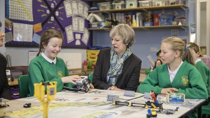 Theresa May hung out with some primary school children and it looks like she had a ball