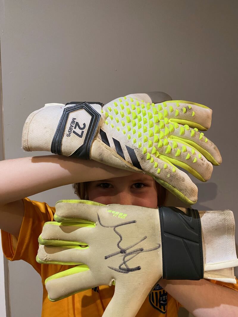 The gloves have been worn and signed by Mary Earps
