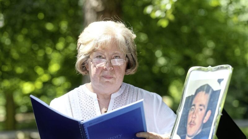 Marian Walsh reads a Police Ombudsman report into the murder of her son Damien. Picture by Hugh Russell. 