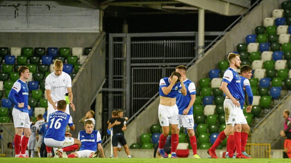 Linfield players react after their defeat on penalties to RFS in the Europa Conference League play-off at Windsor Park last night   Picture: Andrew McCarroll/ Pacemaker Press. 
