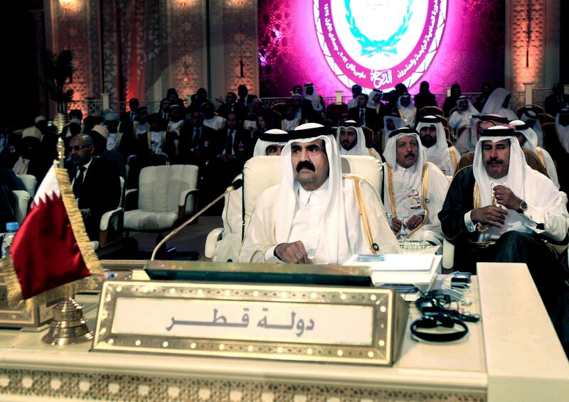 Emir of Qatar Sheikh Hamad Bin Khalifa Al Thani attends the opening session of the Arab League Summit in Doha in March 2013 (Ghiath Mohamad/AP)