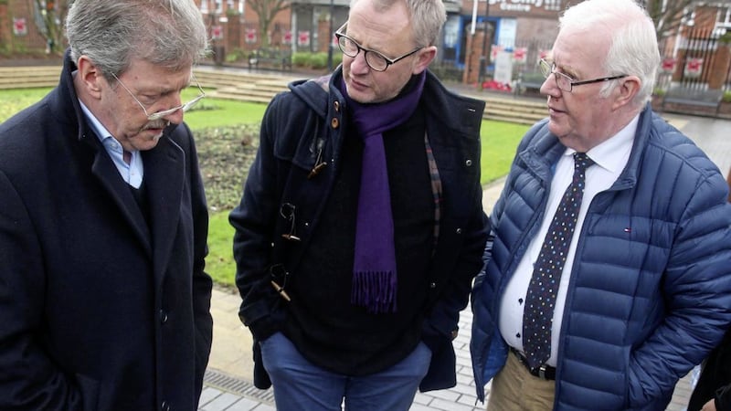Stephen Travers, Alan McBride and Eugene Reavey meeting at the Shankill bomb memorial garden 