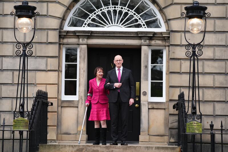John Swinney with his wife Elizabeth Quigley on the steps of Bute House in Edinburgh