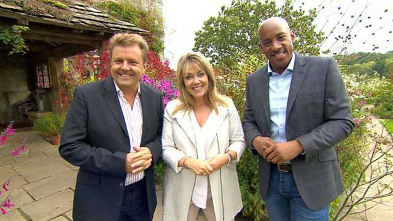 Under the Hammer presenter Lucy Alexander with her co-hosts Martin Roberts, left, and Dion Dublin. Picture by BBC