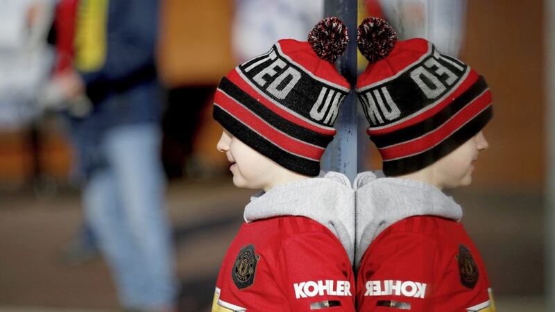 A young Manchester United fan at Old Trafford. PA Photo. 
