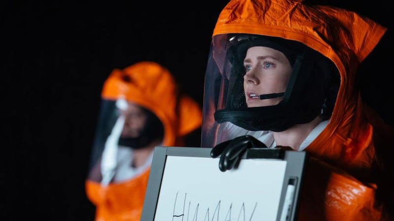 Amy Adams plays an emotionally scarred linguistics expert hired to decipher a coded language used by aliens in Arrival 