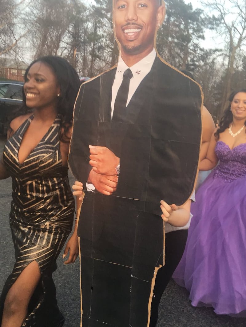 A prom-attendee with a Michael B. Jordan cardboard cutout