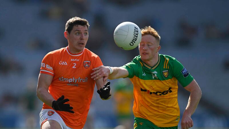 Armagh’s Paddy Burns beats Donegal’s Oisin Gallen to the ball in the Division Two final at Croke Park, Dublin. Picture Mark Marlow