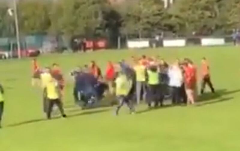 Footage appears to show the referee being knocked to the ground