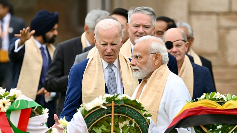 US president Joe Biden, centre, Indian prime minister Narendra Modi, and other G20 leaders pay their tributes at the Rajghat, a Mahatma Gandhi memorial, in New Delhi (Kenny Holston/AP)
