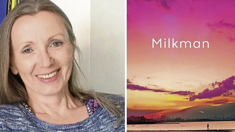 Anna Burns with the cover of her novel Milkman 