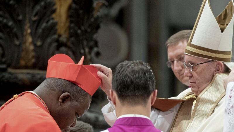 New Cardinal Dieudonne Nzapalainga, Archbishop of Bangui, Central African Republic, receives the red three-cornered biretta hat 