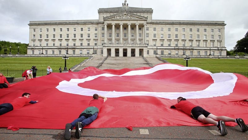 An Dream Dearg campaigners pictured at Stormont back in May as legislation on Irish language was introduced at Westminster. Picture by Mal McCann 