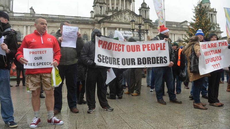 An anti-refugee rally took place  at Belfast City Hall ahead of the arrival of Syrian refugees