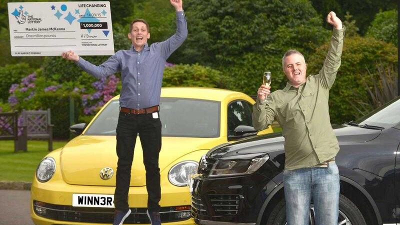 Co Down man Martin McKenna (right in the green shirt) celebrates with friend Gerard after winning &pound;1 million on a scratchcard 