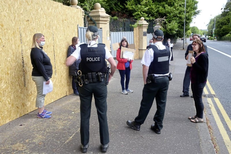 Police speak to residents protesting at the ongoing work on a wall surrounding the Chinese Consulate in south Belfast. Picture by Mal McCann 
