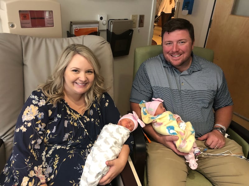 Rebecca and Brannan Williams with their twin daughters 