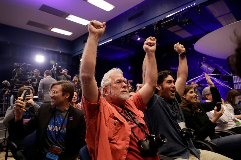 People celebrate as the InSight lander touchdowns on Mars at Nasa's Jet Propulsion Laboratory