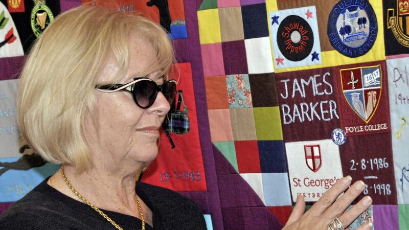 Donna-Maria Barker, whose son James was killed in the Omagh bomb, helped to unveil a patchwork quilt during a ceremony honouring children who had died during the Troubles. Photograph by Alan Lewis . 