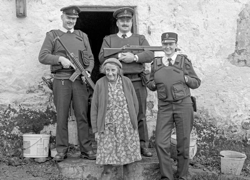 Sarah Primrose, who lived on a Co Tyrone farm with no electricity or running water, with a RUC neighbourhood watch patrol from Clogher station. Picture from Bobbie Hanvey Photographic Archives, John J. Burns Library, Boston College, Courtesy of the Trustees of Boston College 