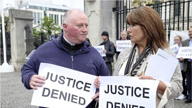 Margaret McGuckin of pressure group SAVIA and FR Patrick McCafferty at the survivors Vigil outside Belfast City Hall Picture by Hugh Russell. 