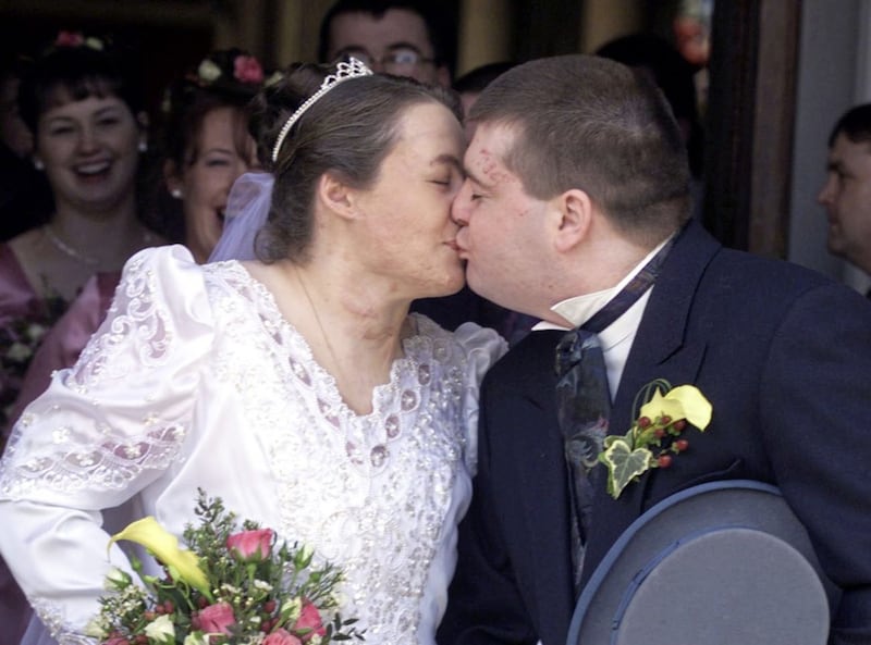 Donna Marie Keyes and Garry McGillion kissing after their wedding at the Sacred Heart Church in Omagh in 1999. Picture by Paul Faith, Press Association
