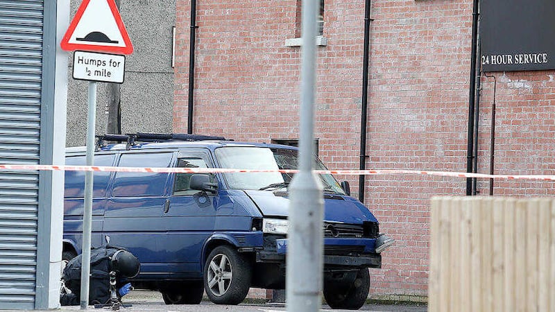 A bomb disposal expert examines the scene in east Belfast where a device exploded under a van. Picture by Mal McCann 