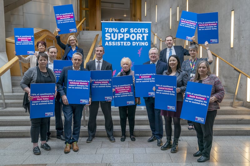 Liam McArthur, centre left, with other MSPs who support his Bill