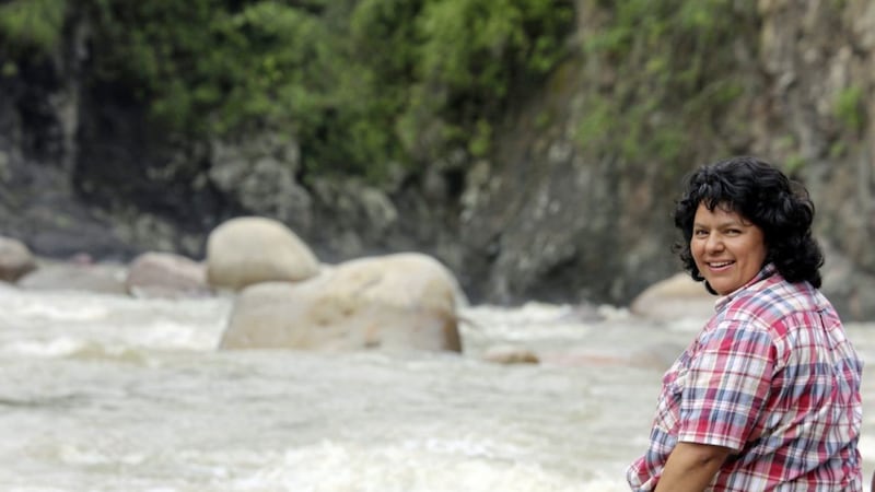 Berta C&aacute;ceres sits on the bank of the Gualcarque River in the R&iacute;o Blanco region of western Honduras where she, COPINH (the Council of Popular and Indigenous Organizations of Honduras) and the people of R&iacute;o Blanco, protested against the construction on the Agua Zarca hydroelectric project. Picture from the Goldman Environmental Prize