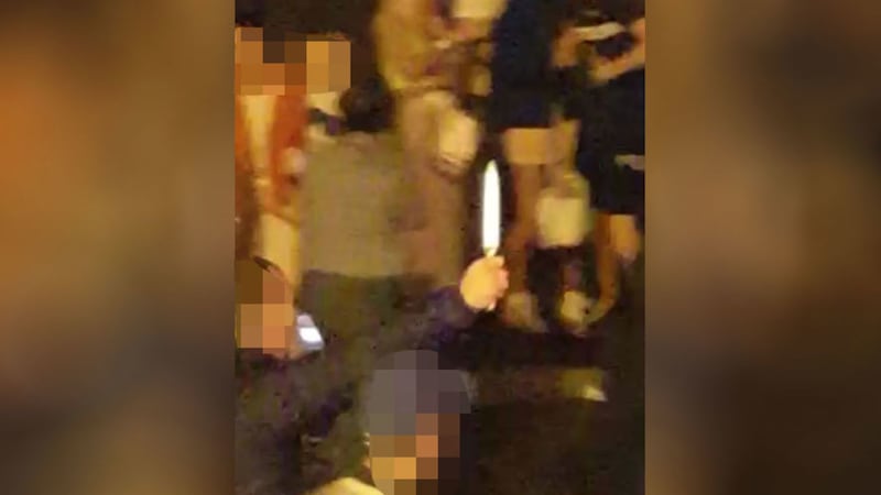 &nbsp; A still from a video which is circulating on social media and was purportedly filmed last night in New Lodge and shows a man holding a knife