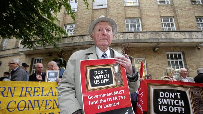 Pensioner Eric Harvey protests outside BBC headquarters in Belfast over plans to cut free TV licences for over-75s. Picture by Mal McCann. 