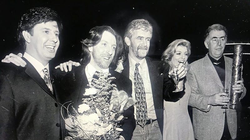 Paul Harrington and Charlie McGettigan with Brendan Graham, pictured far right, with Eurovision hosts Cynthia N&iacute; Mhurch&uacute; and Gerry Ryan, after winning the 1994 contest with Rock &#39;n&#39; Roll Kids. 