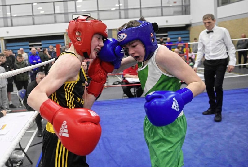 Star&rsquo;s Cormac Moore (left) and Harrison McGall of All Saints put on a fine display during the Boy 2 43kg Antrim 6s final at Ballysillan leisure centre, with Moore having his hand raised at the end of a competitive bout. Picture by Mark Marlow 