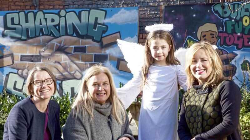 Angelic cherub Sophie Douglas 7) urges volunteers to sign up for Be a Saint Day on Friday March 16. With her are (from left) Denise Hayward, chief executive of Volunteer Now; Denise Cranston, head of communities at Business in the Community and Emma Gibson, Henderson Group HR manager 