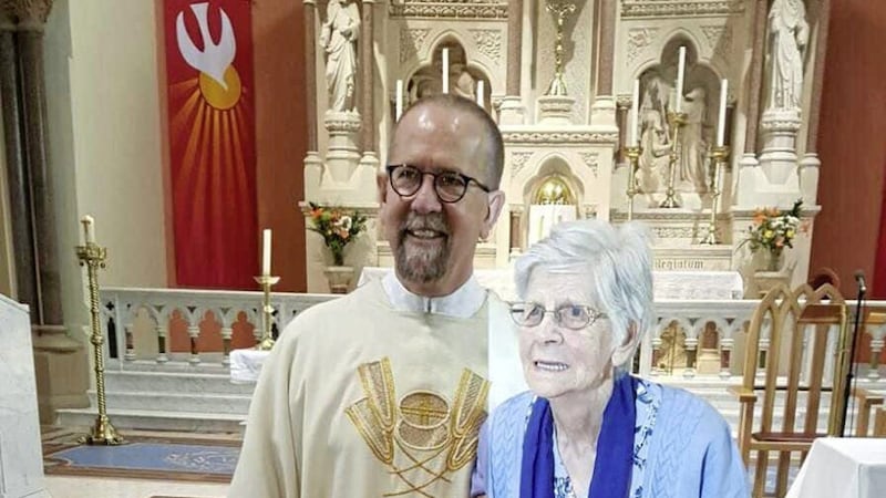 Fr Stephen Rooney, pictured with his late mother, Catherine, often said Mass at his home parish church of St Matthews in Belfast. Picture courtesy of the Rooney Family 