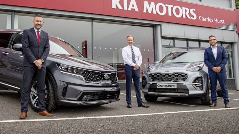 Celebrating the new Kia dealership in Newtownabbey are (from left) Andrew Gilmore, brand director; Jason Hawthorne, Kia franchise sales manager; and Stephen Morton, Kia Newtownabbey sales manager 