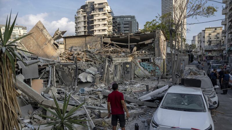 The rubble of a building in Tel Aviv after it was hit by a rocket fired from the Gaza Strip (Oded Balilty/AP)