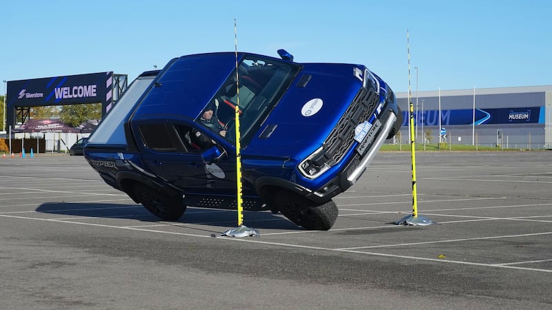 Paul Swift achieves the Guinness World Record for ‘The tightest gap driven through on two wheels in a pickup truck (88cm)’ in celebration of Guinness World Records Day 2023 (Guinness World Records Day 2023)