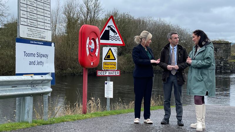 First Minister Michelle O’Neill, Agriculture, Environment and Rural Affairs Minister Andrew Muir and deputy First Minister Emma Little-Pengelly on the shores of Lough Neagh during a visit to the Lock Keepers Cottage in Toome