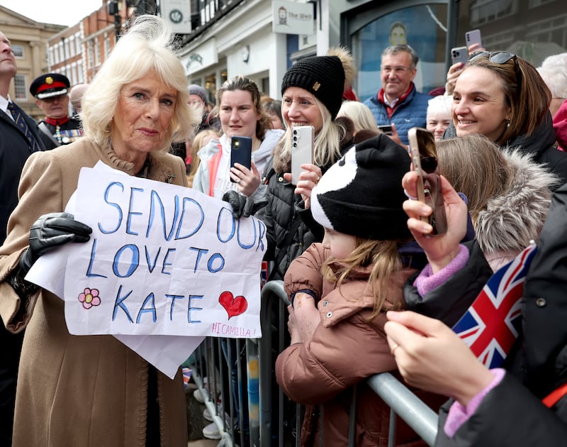 Queen Camilla receives a message of support for the Princess of Wales from well-wishers, during a visit to the Farmers’ Market in The Square, Shrewsbury