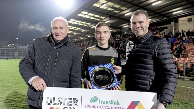 Fifteen-year-old Ciaran McGinley, from Naomh Eanna, Glengormley (centre) was presented with the Translink and Ulster GAA Young Volunteer of the Year by Ulster GAA president Oliver Galligan, along with club coach John McKay. 