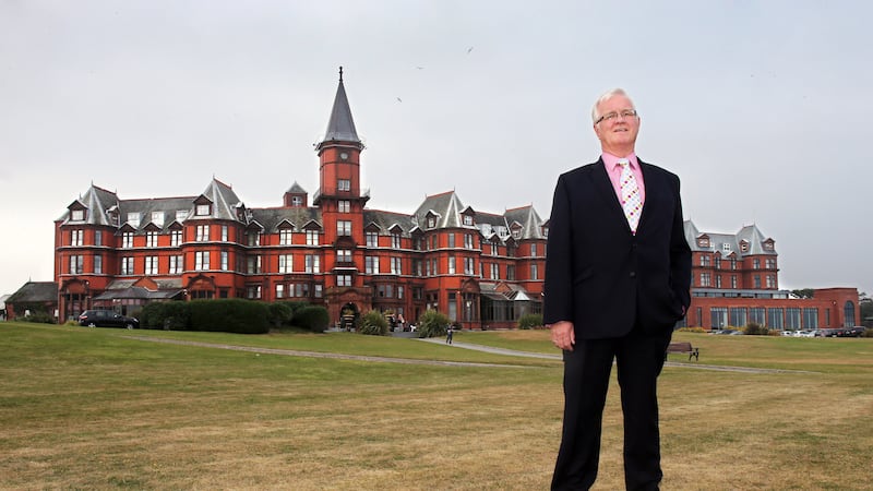 John D Toner pictured in front of the Slieve Donard Hotel in Newcastle upon his retirement in 2013 after an illustrious four decade career in the hospitality industry PICTURE: MAL MCCANN