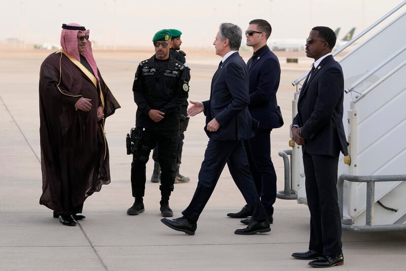 US Secretary of State Antony Blinken is welcomed by Mohammed Al-Ghamdi, MFA director of protocol on his arrival at King Khalid International Airport, in Riyadh, Saudi Arabia on Monday (Mark Schiefelbein/AP)