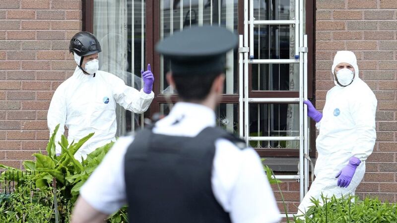 Forensic officers carry out a search following a gun attack on a house in Ballynamoney Road area of Lurgan. Picture Mal McCann. 