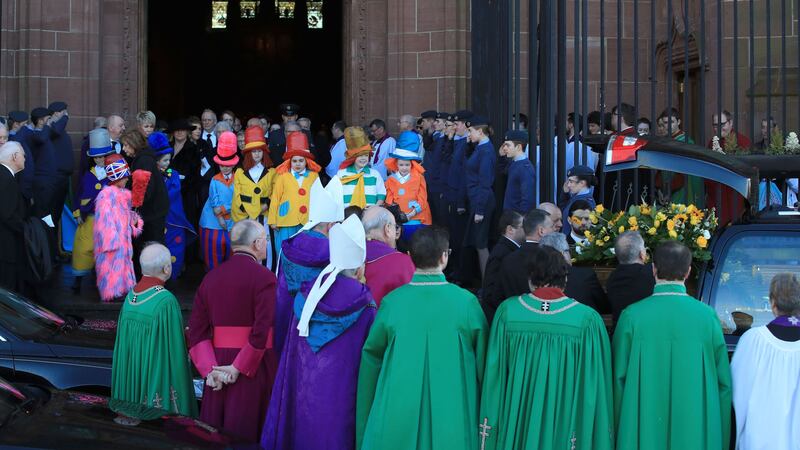 Thousands lined the route to Liverpool’s Anglican Cathedral which was full for the comedian’s funeral.
