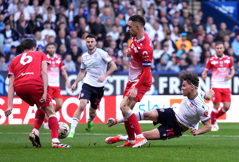 Bolton’s Dion Charles has a shot on goal blocked by Barnsley’s Mael Durand De Gevigney during the Sky Bet League One play-off, semi-final, second leg tie .