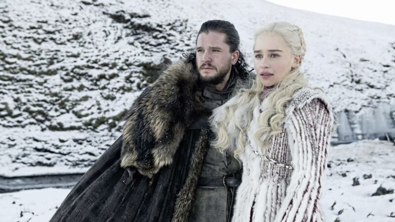 Game of Thrones actors Kit Harington, who plays Jon Snow, and Emilia Clarke, who portrays Daenerys, scan the horizon for huskies. 