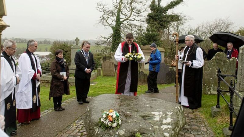 A wreath laying service takes place at the grave of St Patrick, Down Cathedral in Downpatrick, Co Down. Bishop David McClay at the grave of St Patrick flanked by Elaine Kelly who is a nun with the adoration sisters on the Falls road in Belfast. Picture by Mark Marlow 