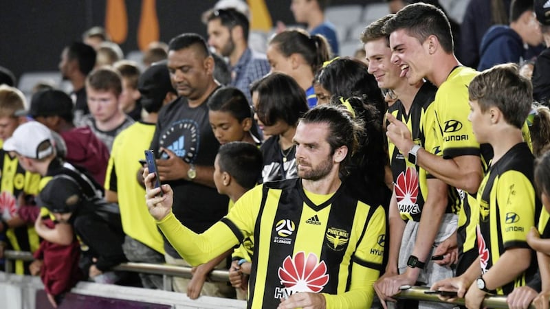 Cillian Sheridan, during his short-lived spell with Wellington Phoenix in New Zealand, takes a selfie with fans after a game against Melbourne Victory. Picture by INPHO 