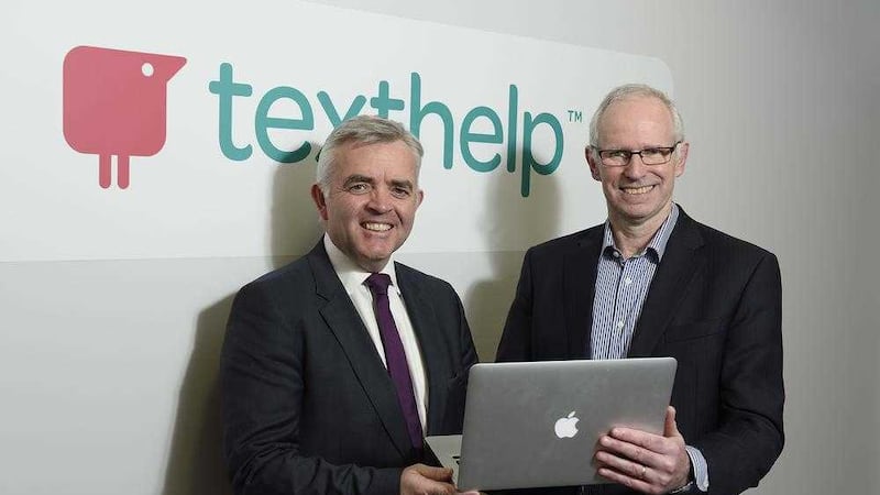 Enterprise minister Jonathan Bell with Texthelp CEO Mark McCusker during a tour of the firm&#39;s headquarters 